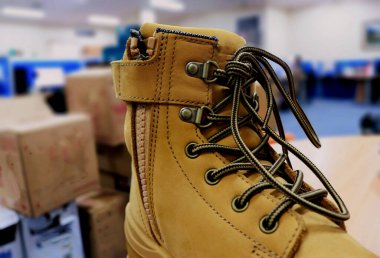 Mocca colored leather shoes for mountaineers, workers, students, motorcyclists. These safety shoes are to protect their feet from the impact of hard objects
