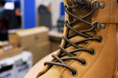 Mocca colored leather shoes for mountaineers, workers, students, motorcyclists. These safety shoes are to protect their feet from the impact of hard objects