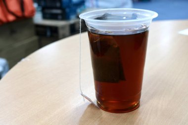 Hot tea in a clear glass in the morning