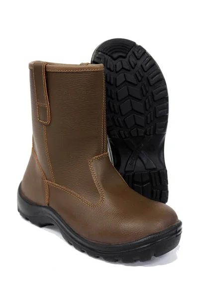作業時に足を保護するために労働者のための茶色のブーツ これらの靴は 建設労働者のための必須の安全装置 — ストック写真