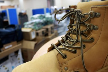 Mocca colored leather shoes for mountaineers, workers, students, motorcyclists. These safety shoes are to protect their feet from the impact of hard objects