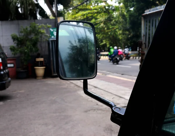 Rearview mirror from a car, this glass serves to see the car behind when driving on the highway and to avoid accidents.