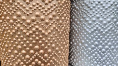 Sivilceli desenli saksıların soyut arkaplanı. 