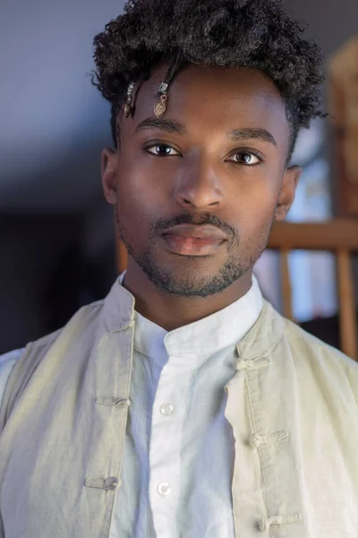 young african man portrait hair jewel handsome guy in his twenties