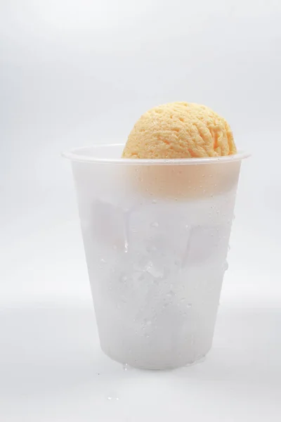 plastic cup of ice cream soda on white background