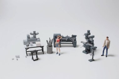 Makinedeki fabrikadaki küçük işçi.