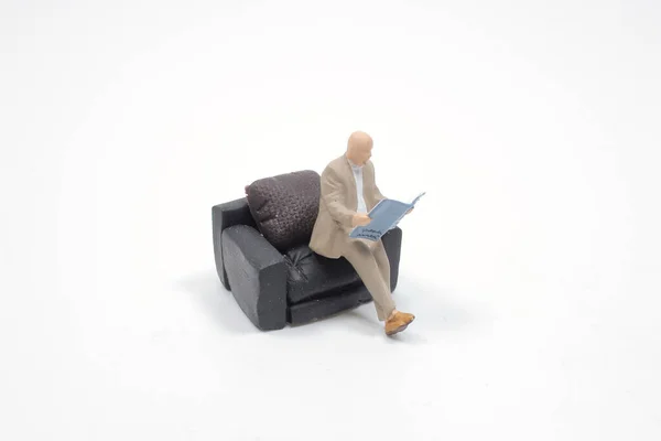 Mini Man Sitting Sofa Reading Book — Stockfoto