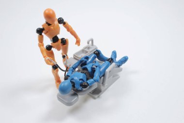  dentist with his assistant examining  patient in dentist office