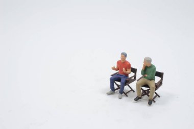 Mini of  film director sit on the Director chair 