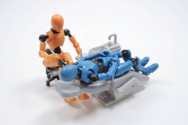  dentist with his assistant examining  patient in dentist office