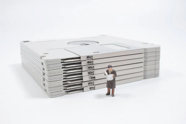 Mini Figure Reading Floppy Disk — Stock Fotó