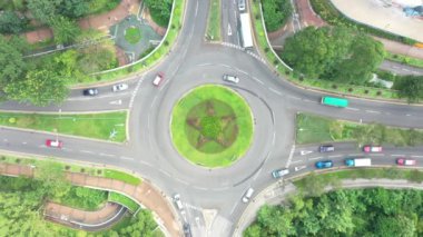 13 Oct 2019 Aerial drone view of roundabout in the city. Cars and trucks moving fast