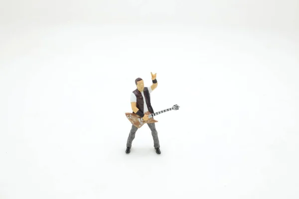 Mini Figure Man Playing Guitar Board — Stock Photo, Image