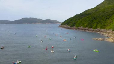 4 May 2022 the rowers on canoes floating to shore at sai kung