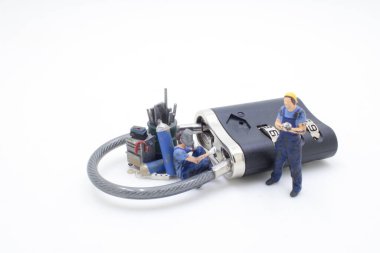  figures and workers trying to saw and crack the lock