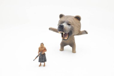 the min of african figure with the bear 