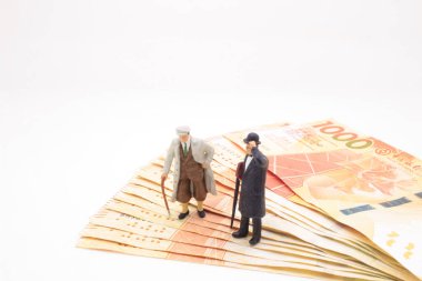 a mini of figure business man  on the bank note