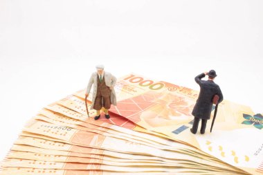 a mini of figure business man  on the bank note