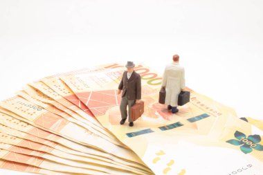 a mini of figure business man  on the bank note