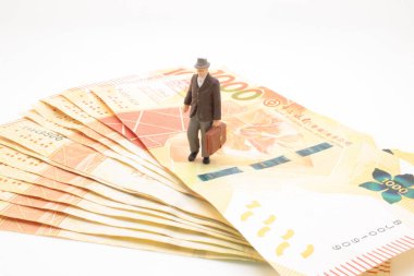 a mini of figure business man  on the bank note