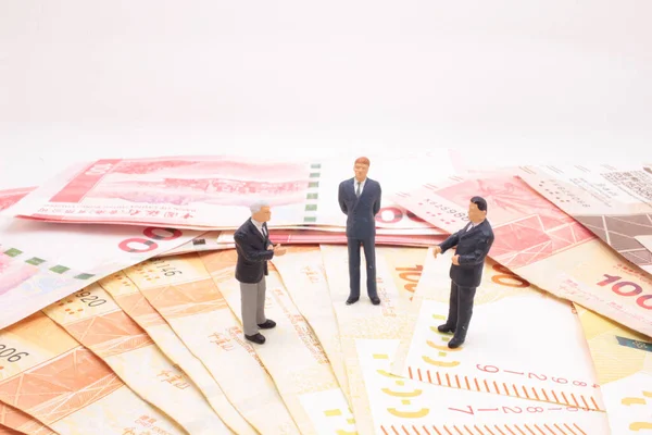 a mini of figure business man  on the bank note