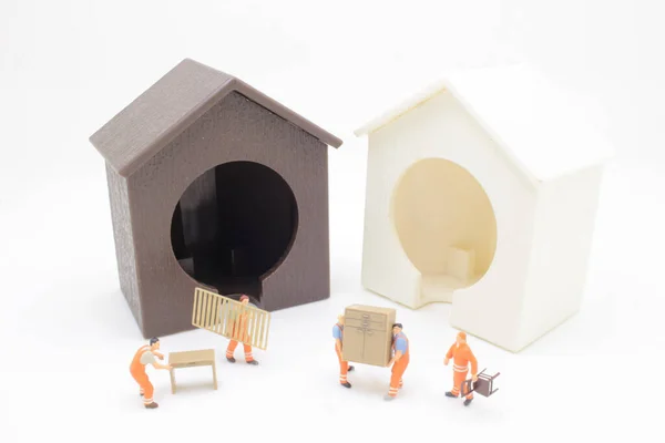 Mini Worker Figure Move Furniture Royalty Free Stock Images