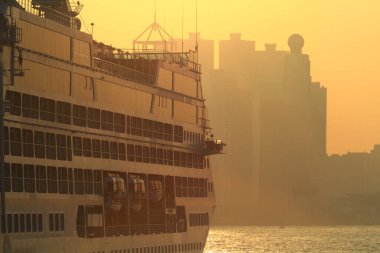 the cruise ship during sunset at hong kong