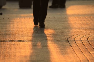 15 OCT 2011 Silhouettes of people walking at the  Promenade, hk