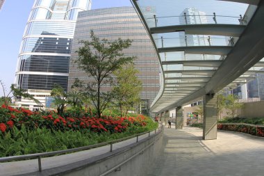 22 Oct 2011 side view of commuters walking through covered footbridge