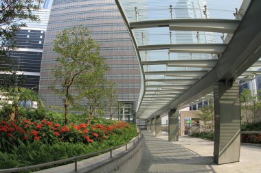 22 Oct 2011 side view of commuters walking through covered footbridge