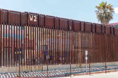 Fence along the border between Arizona and Mexico clipart