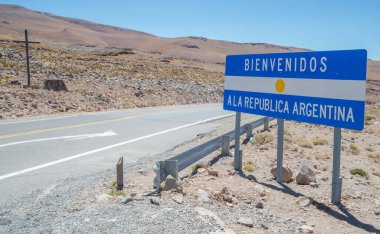 Highway sign on the border between Chile and Argentina in the Andes 