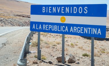 Highway sign on the border between Chile and Argentina in the Andes 