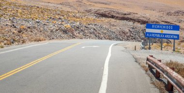 Highway sign on the border between Chile and Argentina in the Andes 