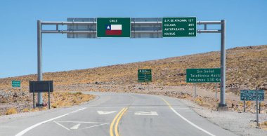 Highway sign on the border between Chile and Argentina in the Andes 