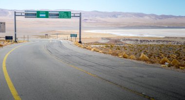 Highway sign on the border of Argentina and Chile in the Andes Mountains