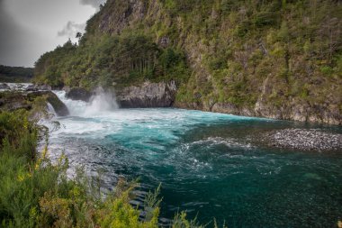 Blue water and rapids on the Petrohue River in Chile