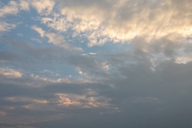 Clouds at sunset against a blue sky