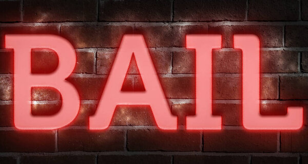 Neon sign on brick wall BAIL 