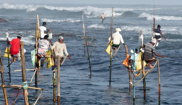 Traditional stilt fishing at a beach in Sri Lanka