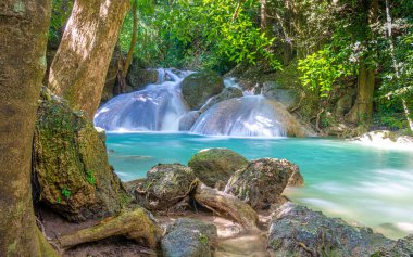 Etherical colors and a waterfall at Erawan National Park in Thailand