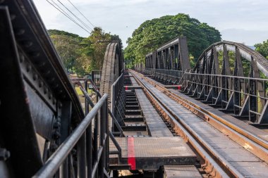 Railroad tracks on the landmark bridge over the River Kwai at Kanchanaburi Thailand