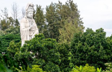 Giant Buddha sculpture at a temple in Kanchanaburi Thailand