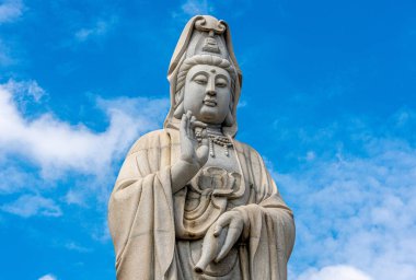 Giant Buddha statue at a temple in Kanchanaburi Thailand