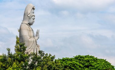 Giant Buddha statue at a temple in Kanchanaburi Thailand