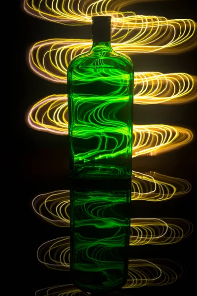 Green Bottle Background Which Illuminated Light Painting — Stockfoto