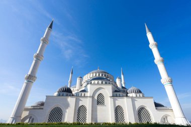 The minarets of an incredibly beautiful newly-opened Camlica Mosque in the clear spring sky of Istanbul. Camlica Mosque is the largest mosque in Turkey.