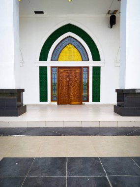old window of a mosque, a beautiful view of the palace in the center of the city. architecture