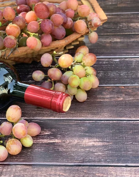 grapes and wine close-up on a wooden background