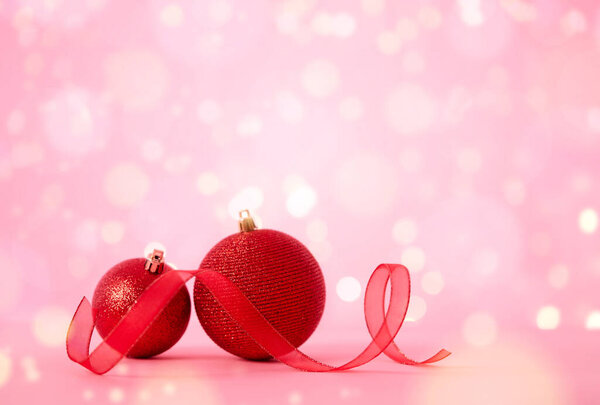 Christmas balls, ribbon and lights background